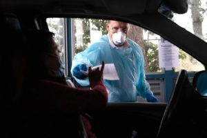 Fire fighter giving COVID tests